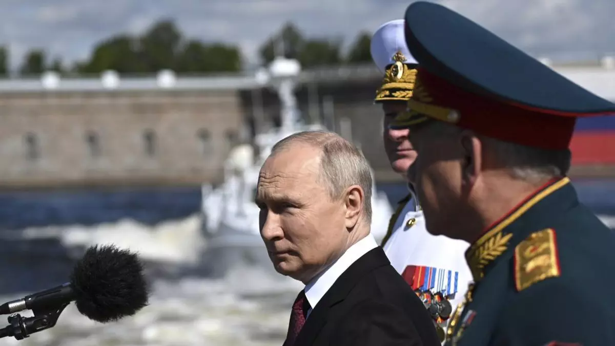 July 30, 2023, St Petersburg, Leningrad Oblast, Russia: Russian President Vladimir Putin, left, reviews the parade of naval vessels accompanied by Russian Defence Minister Sergei Shoigu, right, and Naval Commander Nikolai Yevmenov, center, onboard the naval cutter Raptor on the Neva River, July 30, 2023 in St. Petersburg, Russia. (Credit Image: © Alexander Kazakov/Kremlin Pool/Planet Pix via ZUMA Press Wire)