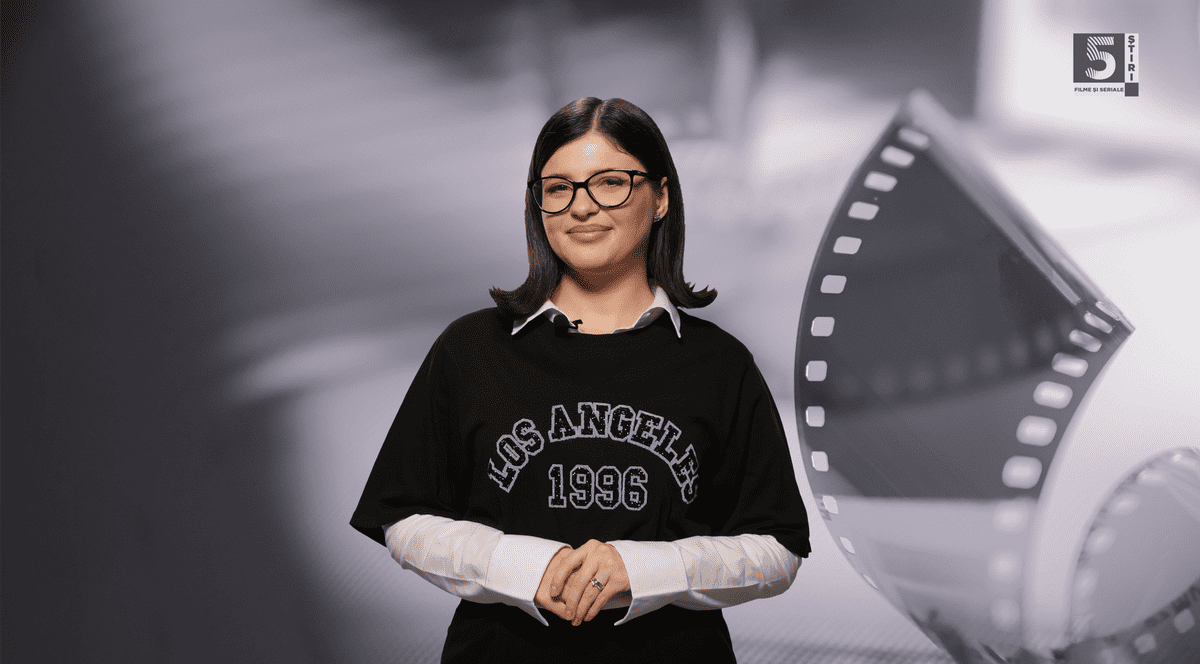 Adelina Duinea într-o bluză neagra cu maneci albe