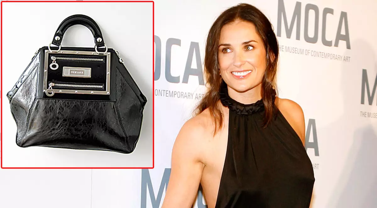 Demi Moore renunţă la geantă pentru copiii români