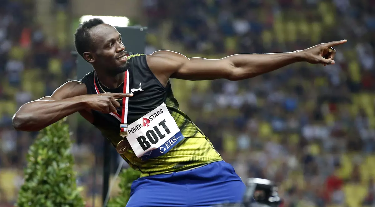 Usain Bolt și celebrul său gest făcut la sfârșitul fiecărei curse câștigate. (FOTO: EPA)
