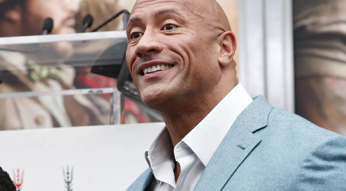 epa08061309 US actor Dwayne Johnson speaks during a hand print ceremony for Kevin Hart at the TCL Chinese Theatre IMAX in Hollywood, Los Angeles, California, USA, 10 December 2019. EPA-EFE/NINA PROMMER