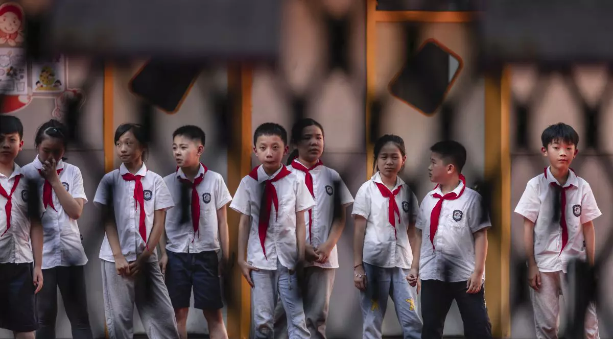 Îndrumare primită de membrii Partidului Comunist chinez, într-un articol din presa de stat: trebuie să aveți trei copii