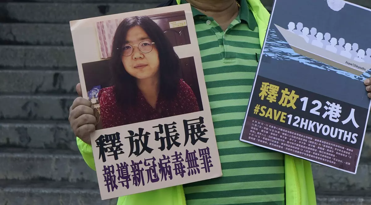 Un activist prodemocrație cere eliberarea lui Zhang Zhan Foto: Profimedia