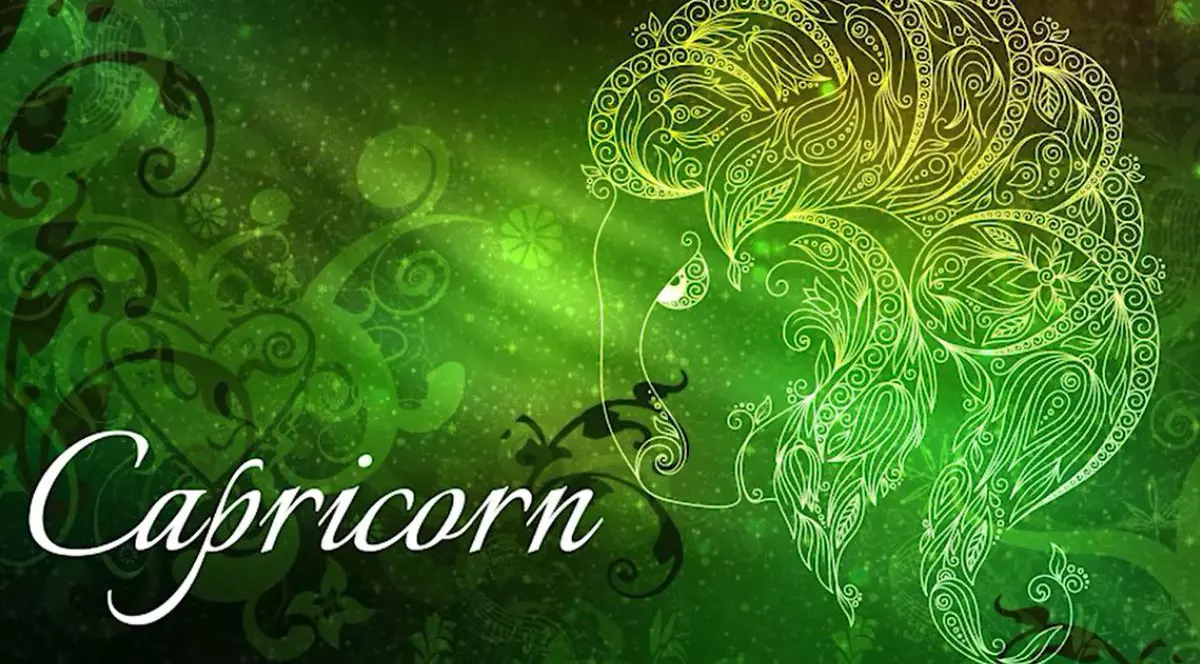 Imagine creativă cu zodia Capricorn, de culoare verde și cuvântul Capricorn scris pe fotografie în partea din stânga jos