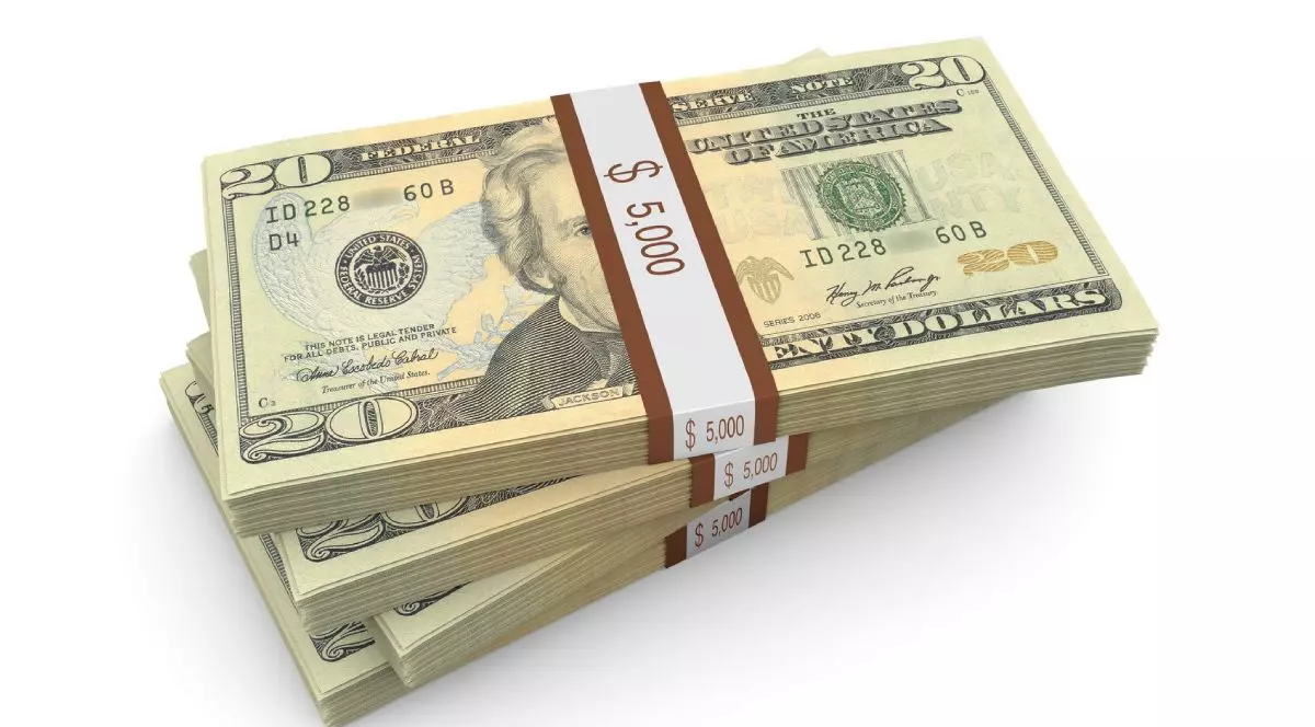 Imagine creativă cu trei teancuri de dolari, în bancnote de 20, pus unul peste celălalt