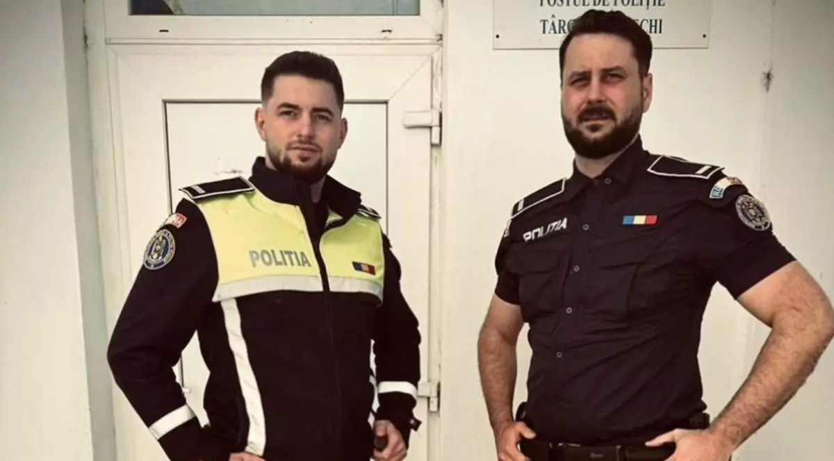 În imagine sunt ilustrați doi agenți de poliție îmbrăcați în uniformă