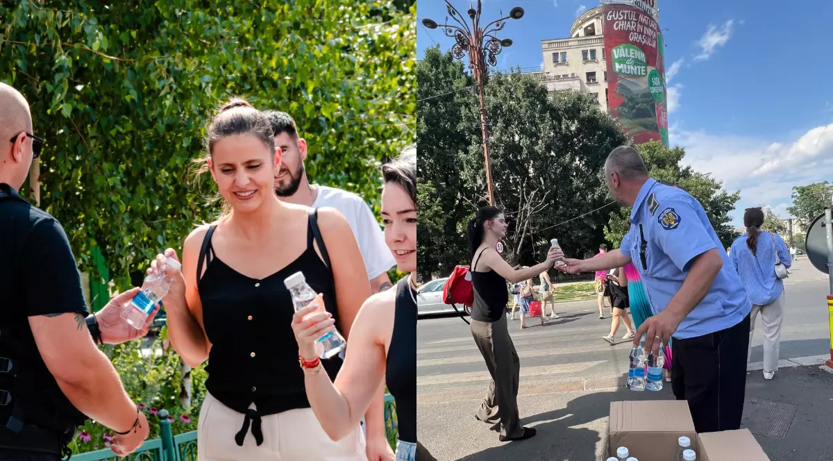 Poliția Locala din București în timp ce împarte sticle cu apă plata la jumătate de litru trecătorilor din zona Piața Unirii