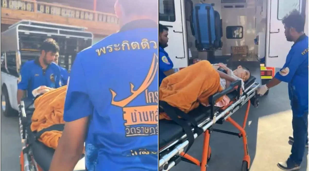 O femeie care a fost găsită vie, într-un sicriu ce urma să ajungă la crematoriu, a fost pusă pe targă și este luată cu ambulanța, noiembrie 2025, Thailanda