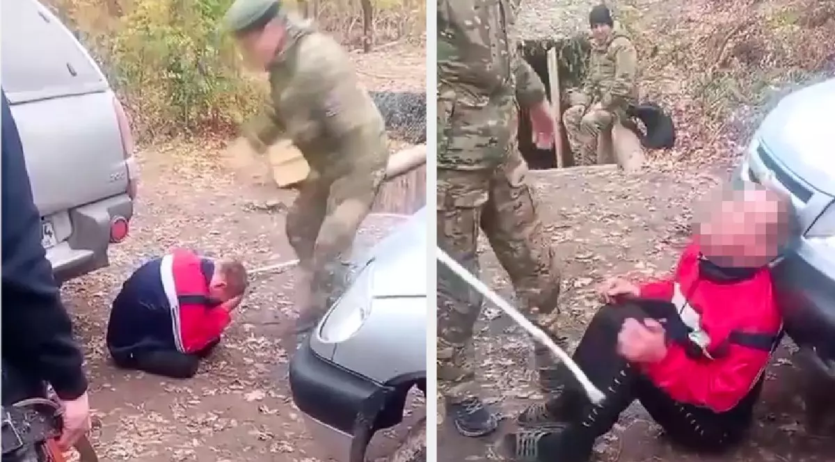 Soldat rus bătut cu un băț de superiorul lui