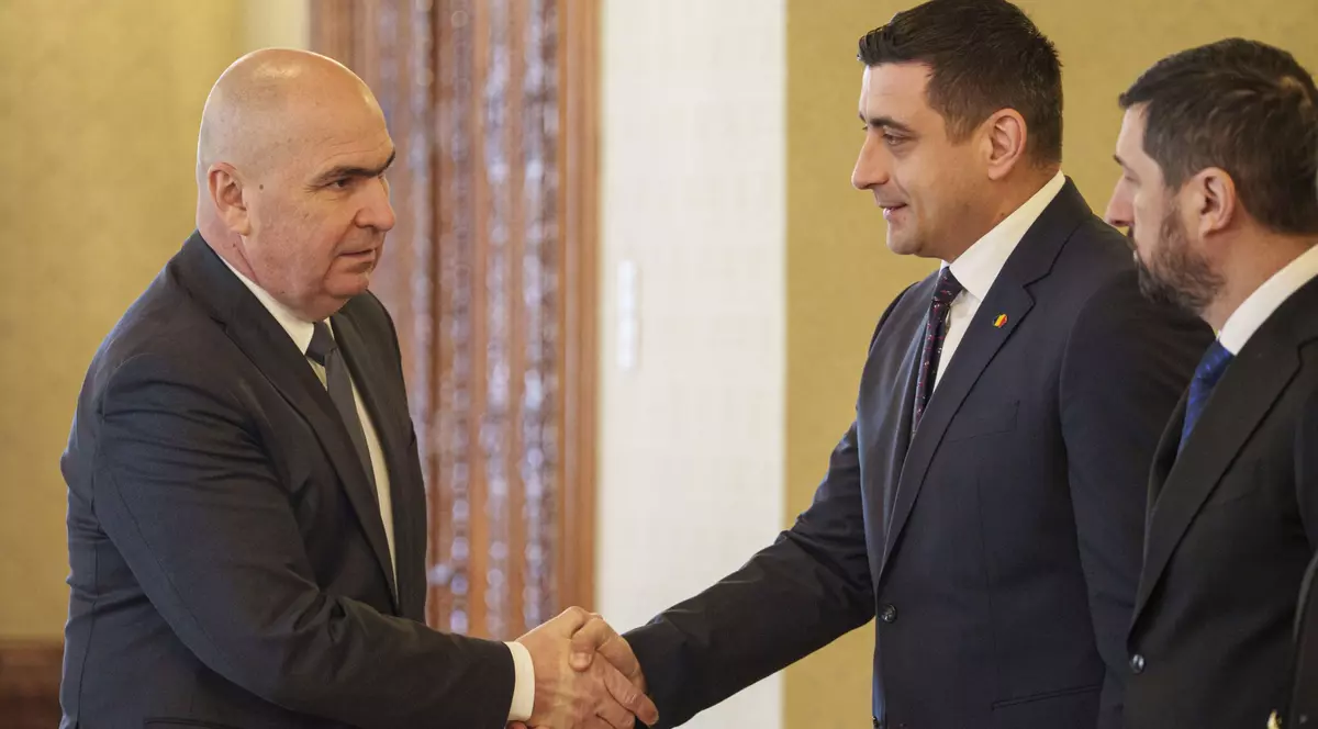 Presedintele interimar al Romaniei, Ilie Bolojan da mana cu presedintele Aliantei pentru Unirea Romanilor (AUR), George Simion inaintea unor consultari, la Palatul Cotroceni din Bucuresti, miercuri, 26 februarie 2025