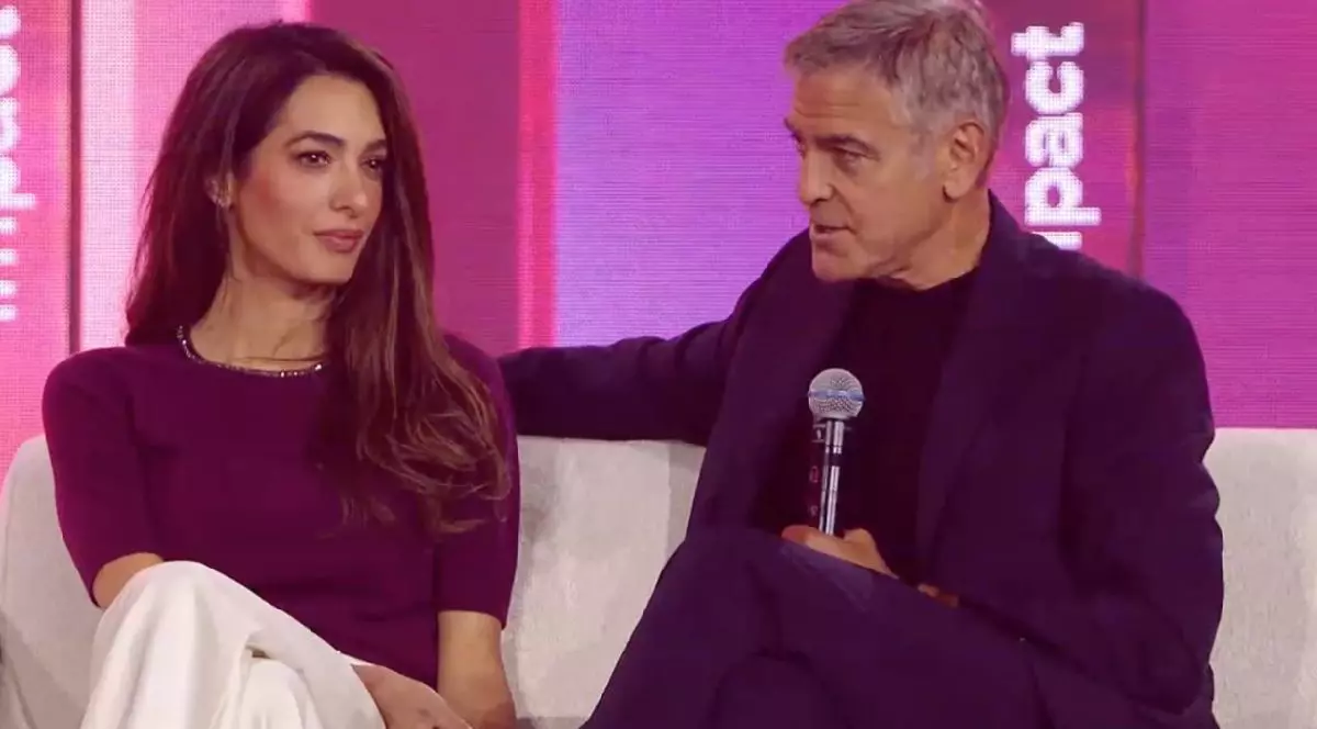 George Clooney pe scena Impact, alături de soția sa Amal. Foto: Impact 2026