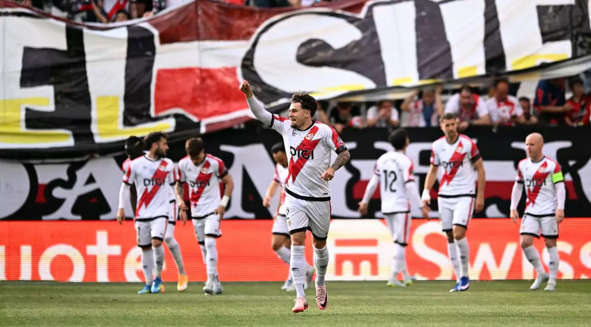 MADRID, SPAIN - APRIL 09: Andrei Ratiu of Rayo Vallecano celebrates his side's first goal scored by Ilias Akhomach of Rayo Vallecano (not pictured) during the UEFA Conference League 2025/26 Quarter-Final Leg One match between Rayo Vallecano de Madrid and AEK Athens FC at Estadio Vallecas on April 09, 2026 in Madrid, Spain. (Photo by Denis Doyle/Getty Images)