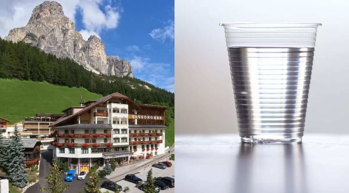 Un hotel din Dolomiti, Italia// Un pahar transparent, din plastic, cu apă
