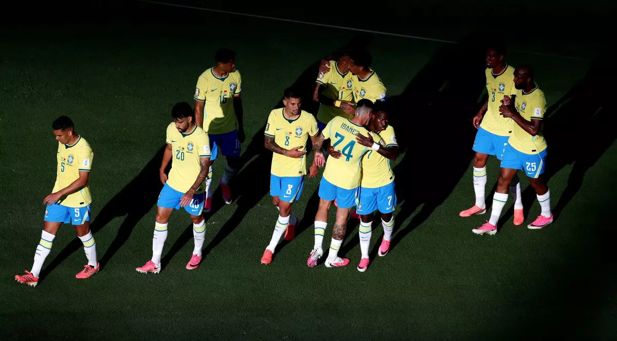 EAST RUTHERFORD, NEW JERSEY - JUNE 13: Vinicius Junior #7 of Brazil celebrates with teammates after scoring the team's first goal during the FIFA World Cup 2026 Group C match between Brazil and Morocco at New York New Jersey Stadium on June 13, 2026 in East Rutherford, New Jersey. (Photo by Al Bello/Getty Images)