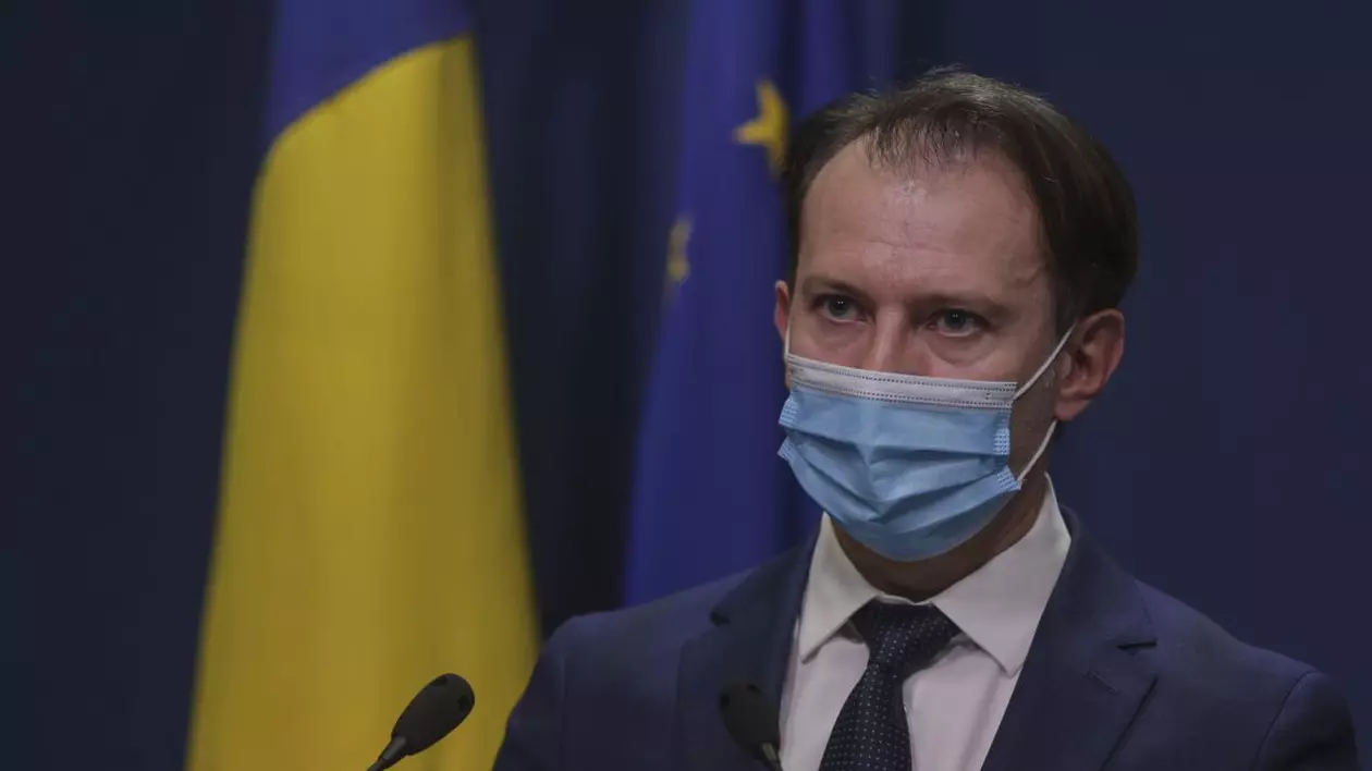 Guvernul amână cu două luni executarea silită a firmelor. Miză de 16 miliarde de lei. Florin Cîțu, ministrul Finanțelor, cu steagurile României și UE în spatele său