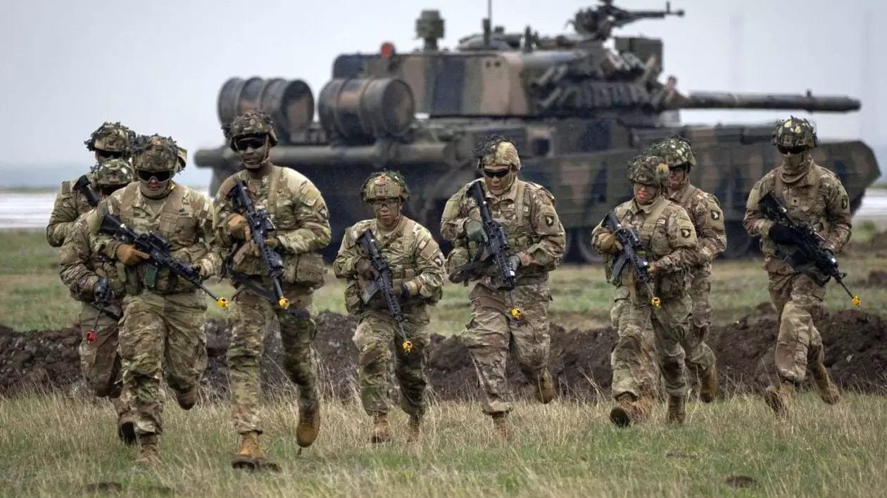 FILE - Servicemen of the United States 101 Airborne Division run during an exercise at the Mihail Kogalniceanu Air Base, near the Black Sea port of Constanta, Romania, Friday, March 31, 2023. Russia’s armed forces are bruised but by no means beaten in the war in Ukraine, a top NATO military officer said Monday, as he laid out the biggest revamp to the organization’s military plans since the Cold War should Moscow dare to widen the conflict.,Image: 786904050, License: Rights-managed, Restrictions: This content is intended for editorial use only. For other uses, additional clearances may be required. FILE PHOTO, Model Release: no