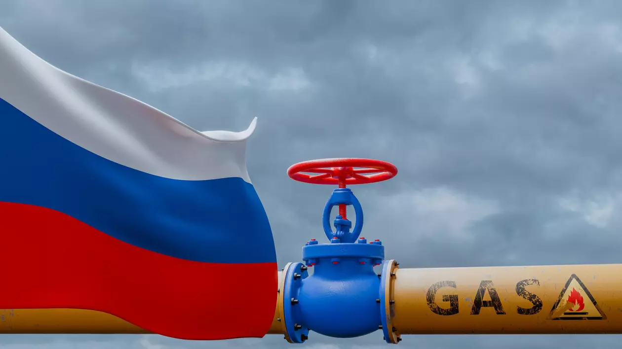 țevi de gaz alături de drapelul Rusiei