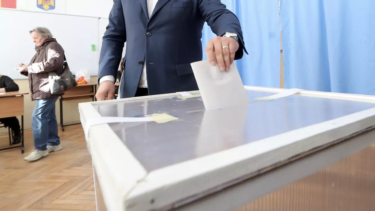 Alegător care introduce buletinul de vot în urnă