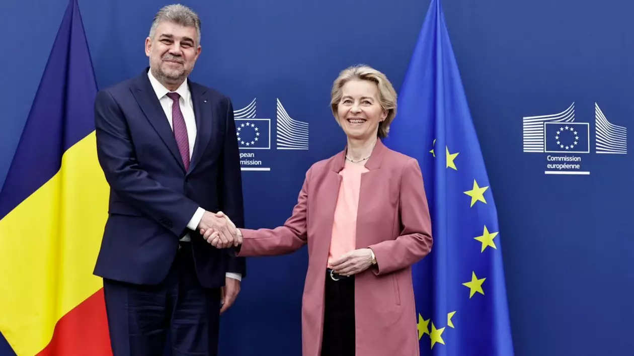 Marcel Ciolacu și Ursula von der Leyen își strâng mâinile la Bruxelles, după întâlnire. Ambii sunt cu zâmbetul pe buze