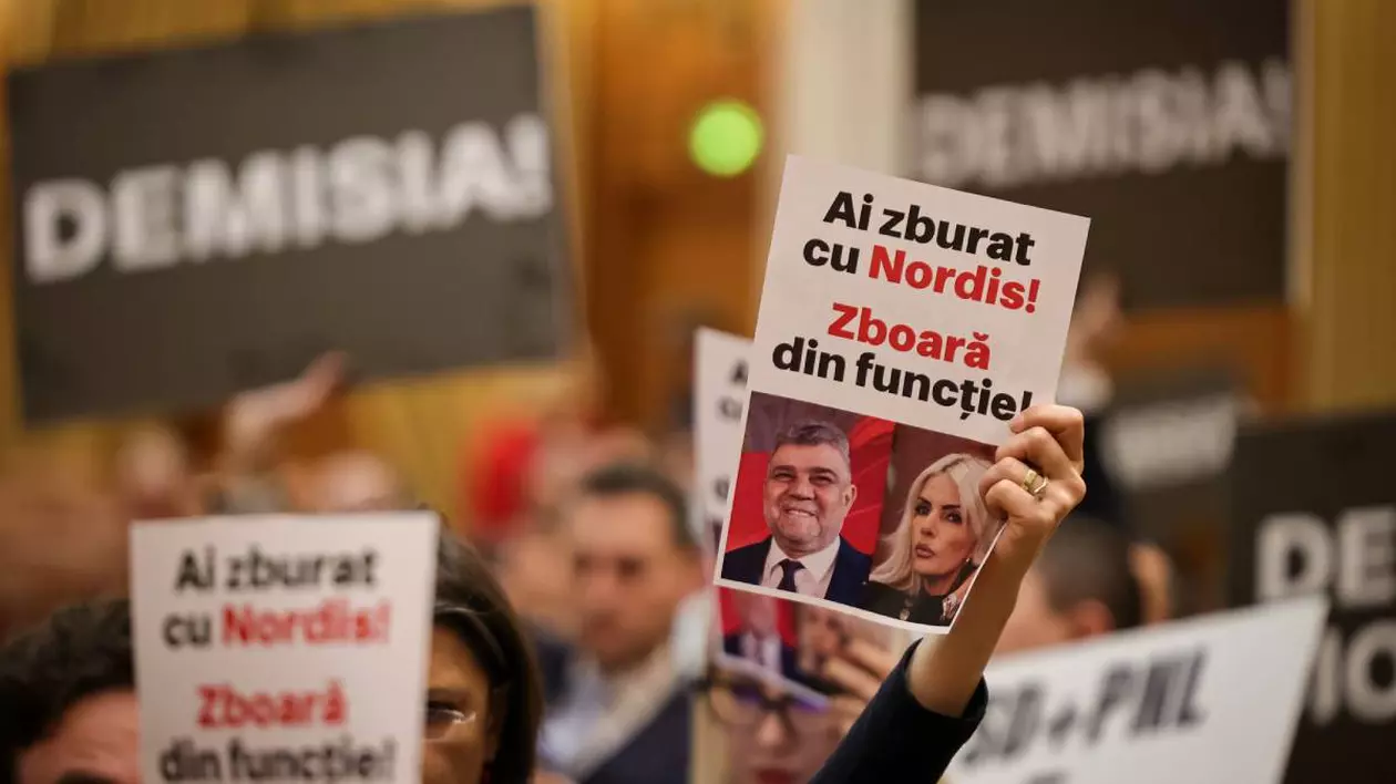 parlamentari in plenul parlamentului tin foi in mana cerand demisia premierului marcel ciolacu