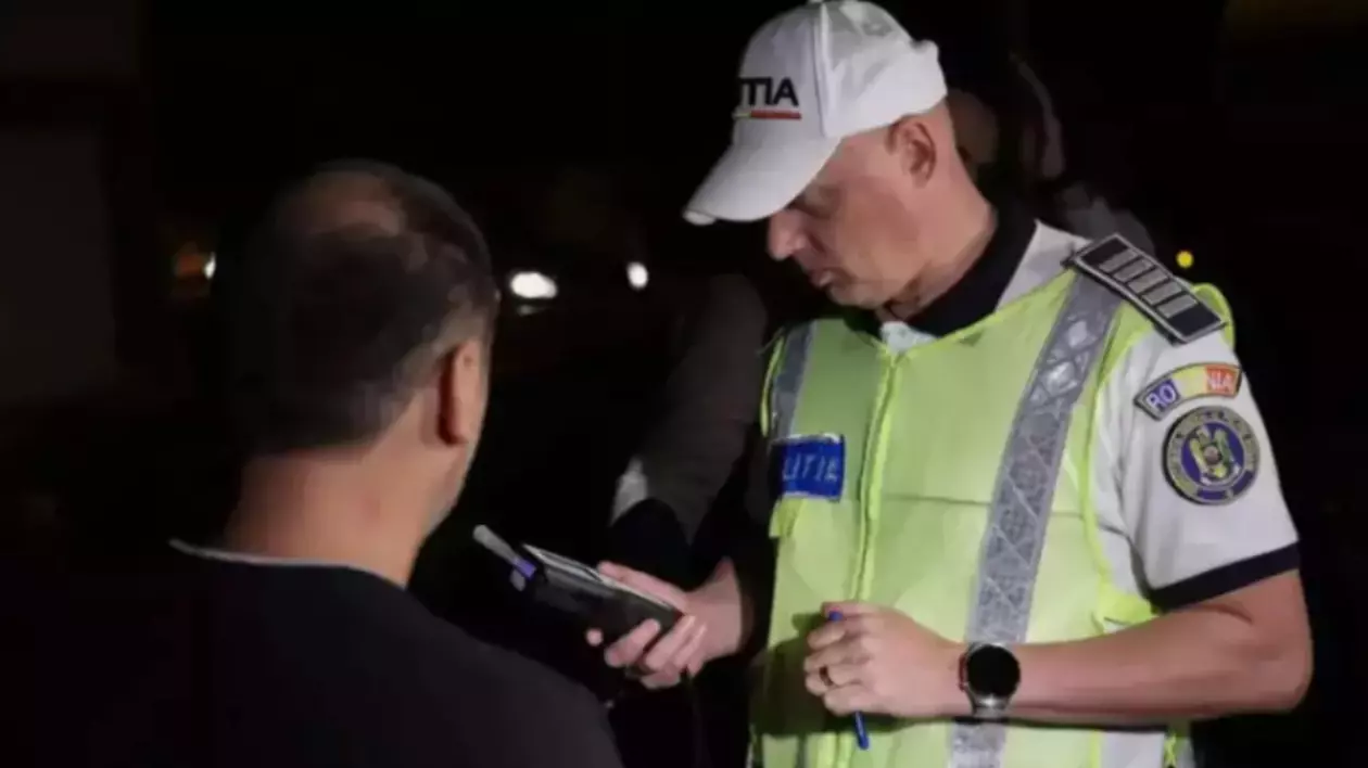 Un șofer în timp ce a fost oprit de polițist