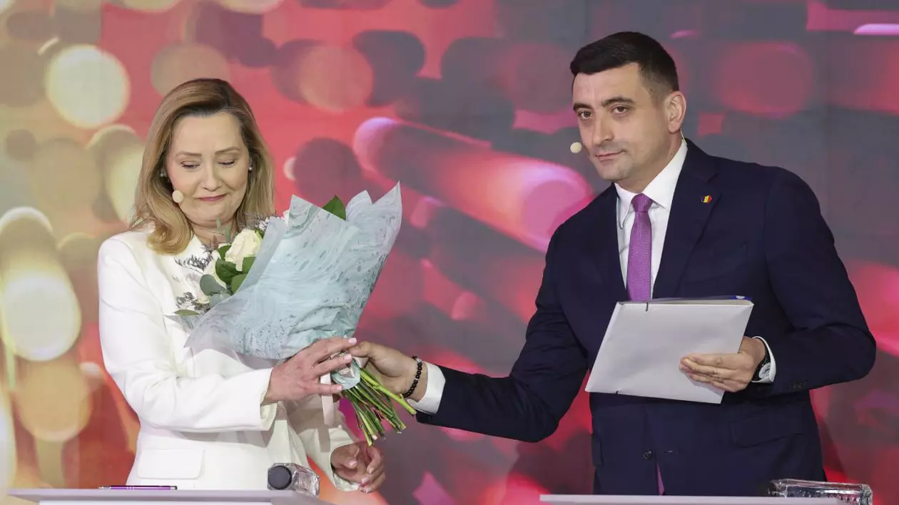 George Simion îi oferă un buchet de flori Elenei Lasconi