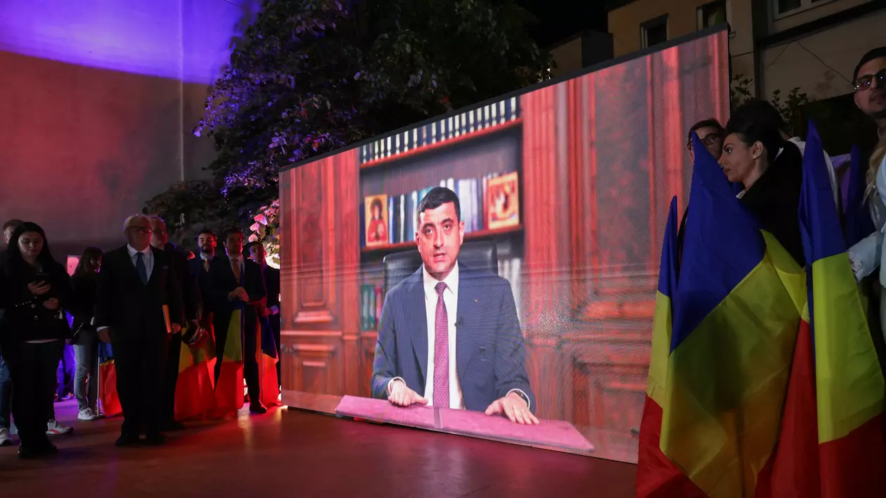 Ecranul de pe scena de lângă sediul AUR după anunțarea rezultatelor la exit-poll-uri