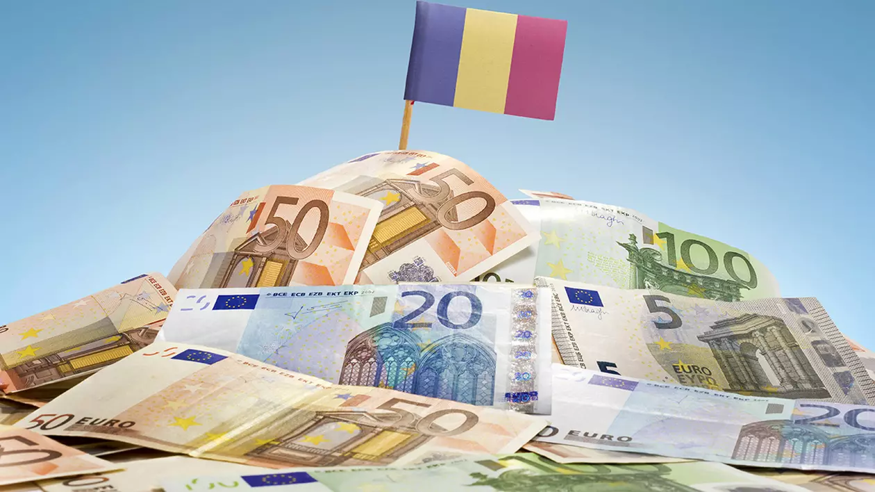 Drapelul național al României lipit într-o grămadă de bancnote europene