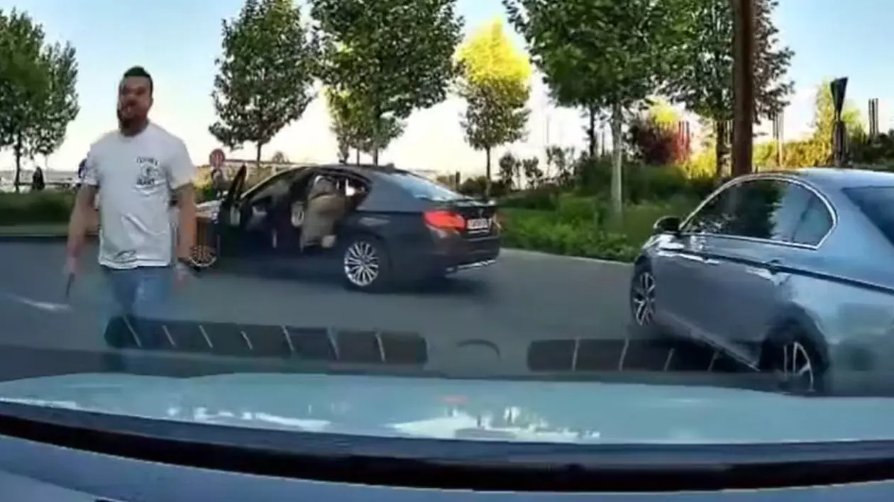 Poză cu șoferul de BMW ținând o rangă în mână
