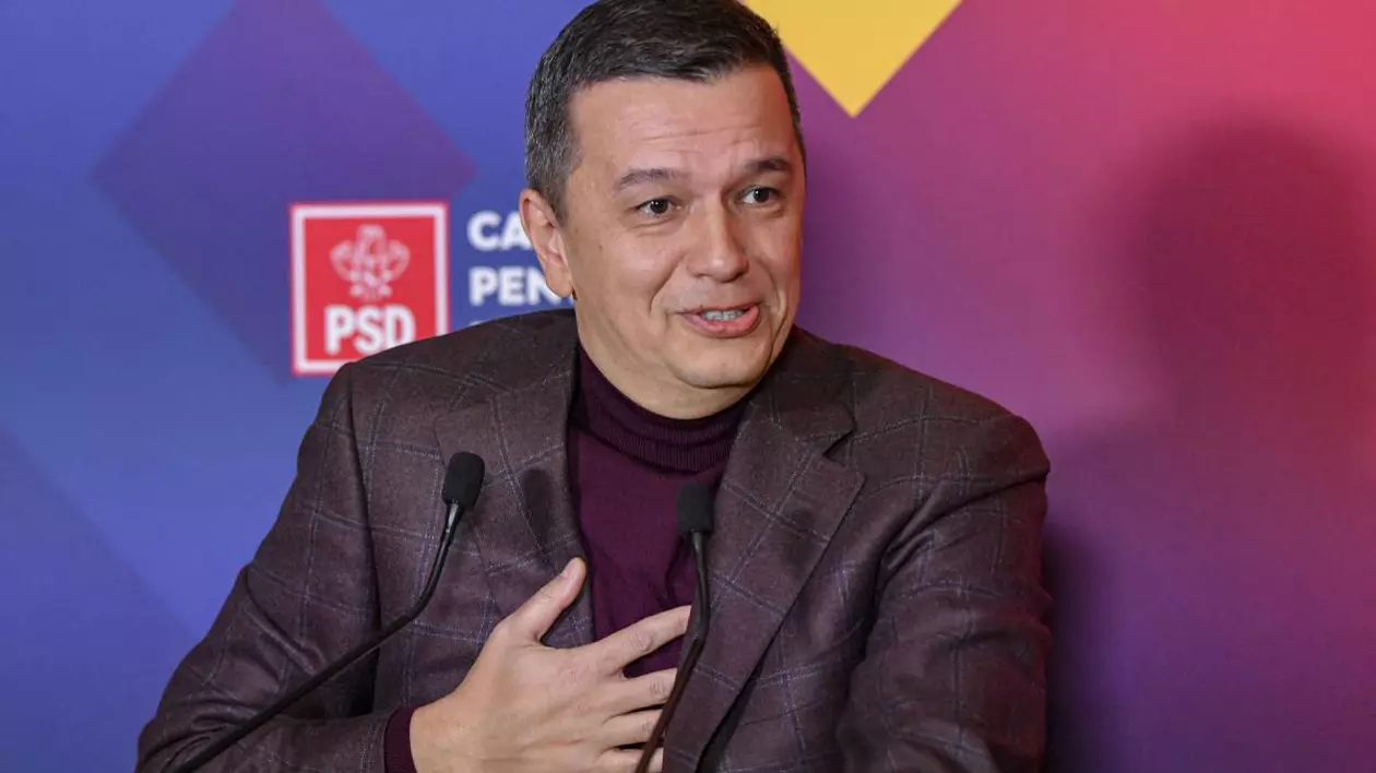 Sorin Grindeanu îmbrăcat la costum, la sediul PSD, în timp ce ține un discurs
