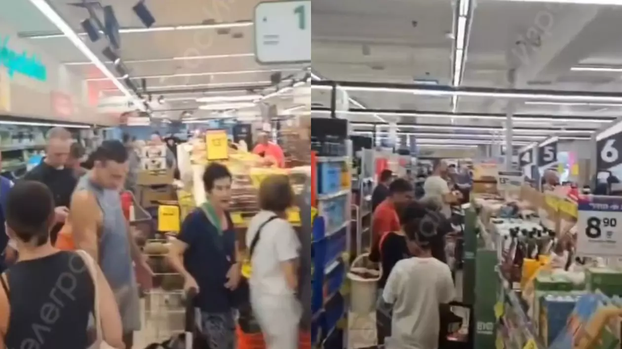 Israelienii în timp ce stau la coadă la Carrefour pentru apă, pâine și hrană pentru bebeluși, s-au închesuit să facă ultimele cumpărături.