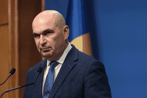 SURSE Grupul politic care ar putea decide soarta lui Bolojan: negocieri tensionate și acuzații dure înainte de moțiune