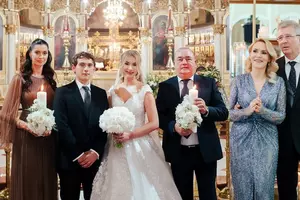 All photos of Gabriela Firea's son's wedding.  How the groom and maid of honor are dressed in church and at a fancy party.  The bride's family is from the United States, Holland and New Zealand