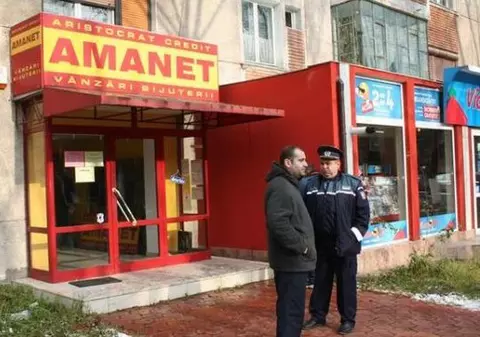 BLESTEM! Casa de amanet unde în 2007 o casieră a fost împuşcată în cap, jefuită din nou astăzi!