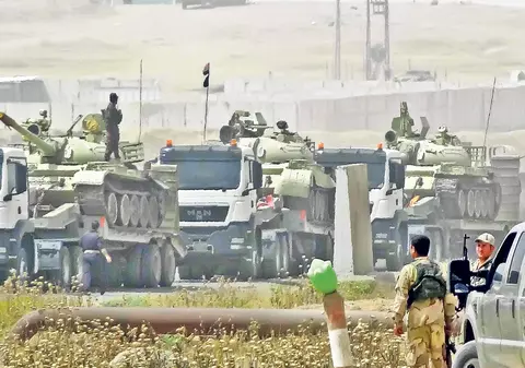 Insurgenţii islamişti au ajuns deja la 60 de kilometri de Bagdad. Cotropesc Irakul din trei direcţii, cu armele abandonate de armată