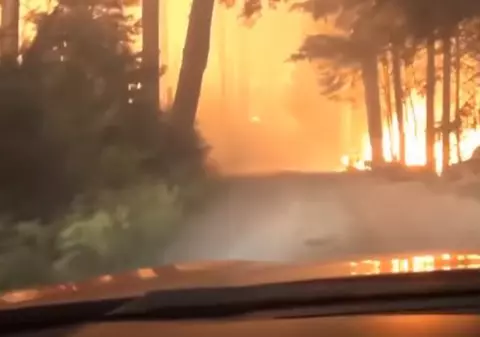 VIDEO | Momentul în care un tată și fiul lui s-au salvat la limită din calea unui incendiu
