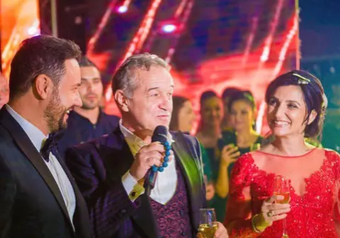 Gigi Becali a făcut spectacol la nunta fiicei sale! A dat câte 200 de euro fiecărui ospătar, a cântat și a aruncat cu mii de euro în aer