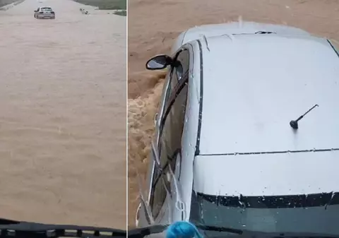 Șofer român de TIR filmat când scoate din șuvoaie o mașină, în timpul inundațiilor din Spania: „Doar un român își riscă viața ca să salveze alte vieți” | VIDEO