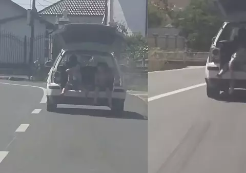 Bărbat din Gorj, amendat cu 1.730 de lei după ce a transportat doi copii în portbagajul maşinii, cu capota ridicată: „Mai are permis?” I VIDEO