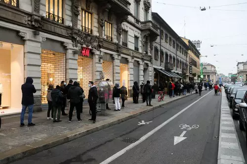 Queue at a pharmacy to purchase rapid test pads for covid-19, Milan, Italy - 24 Dec 2021