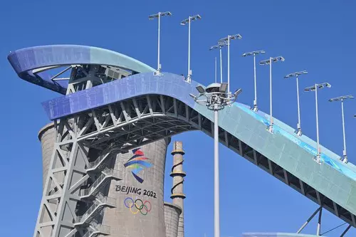 Peking, China. 03rd Feb, 2022. A Winter Olympics logo is seen on the side of an old cooling tower of a steel mill in the city's former industrial area. The Beijing Winter Olympics will take place from 04-20 February 2022 under strict Corona conditions. Cr