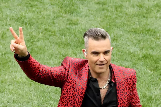 Robbie Williams, acuzat că ”și-a vândut sufletul dictatorului Putin”