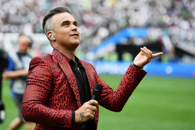 Dan Petrescu a povestit cum a făcut schimb de autografe cu Robbie Williams! Antrenorul de la CFR vrea să ia cina cu artistul care va concerta duminică seară la Untold FOTO: EPA