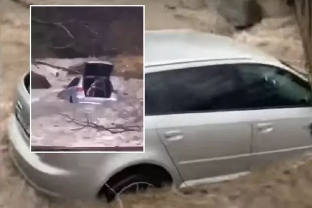 VIDEO | Audi luat de viitură în Prahova, tânărul șofer a vrut să-i arate unei fete cum traversează un râu umflat