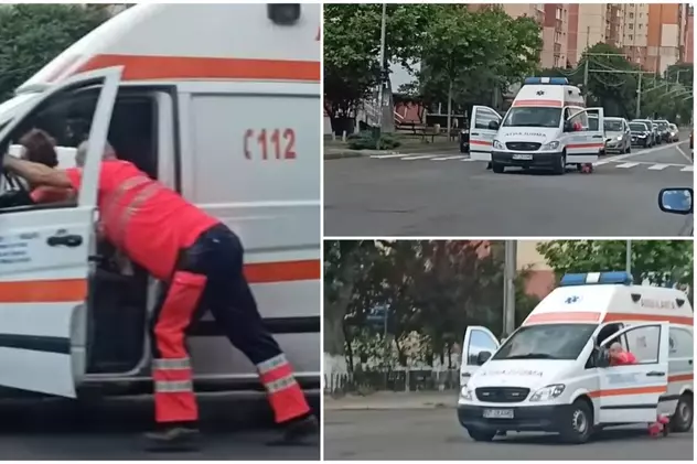 Șoferul și asistenta împing ambulanța stricată în intersecție, la Piatra Neamț. Autoutilitara are peste 1 milion de kilometri la bord