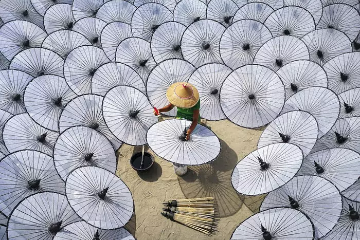 Among the white umbrellas by Aung ThuYa