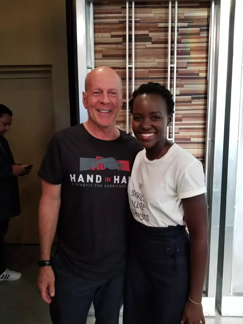 hand in hand bruce willis lupita