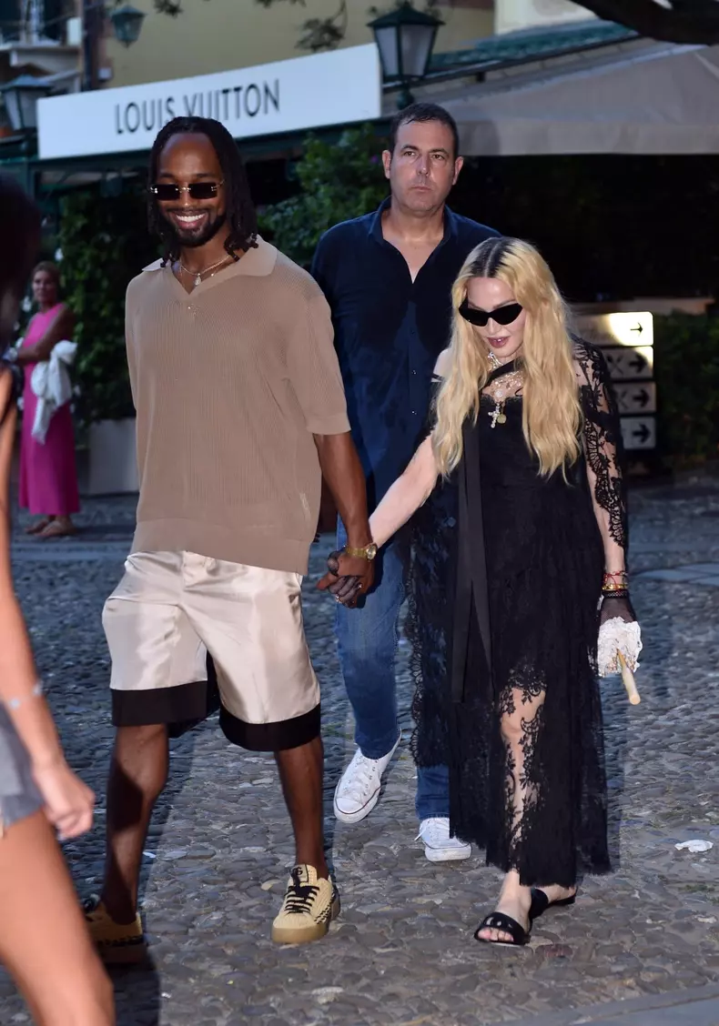 Madonna and her rumoured boyfriend Akeem Morris and a group of friends are pictured out and about in Portofino where they visited a church first before going for dinner at Punny restaurant.Madonna was wearing a D&G outfit.