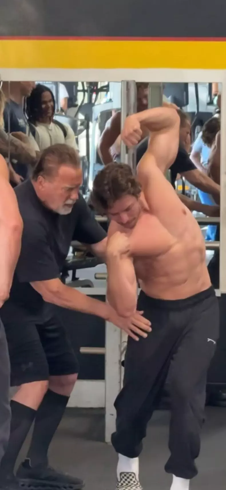 Heart-warming moment Arnold Schwarzenegger teaches bodybuilder son to pose