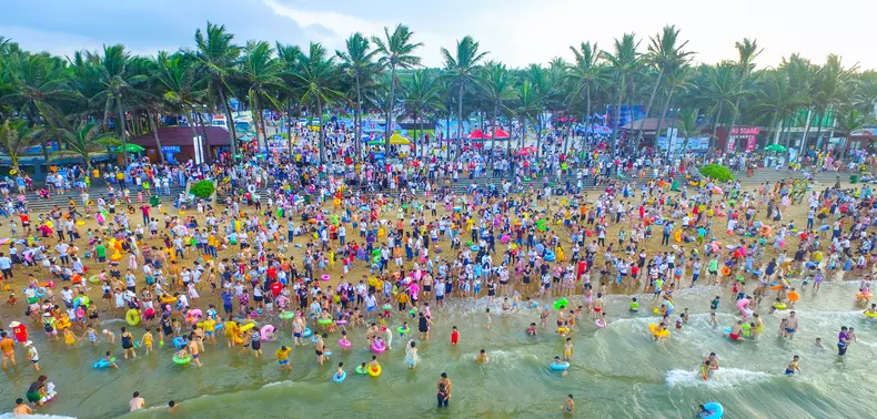 People Crowd At Beach In Haikou